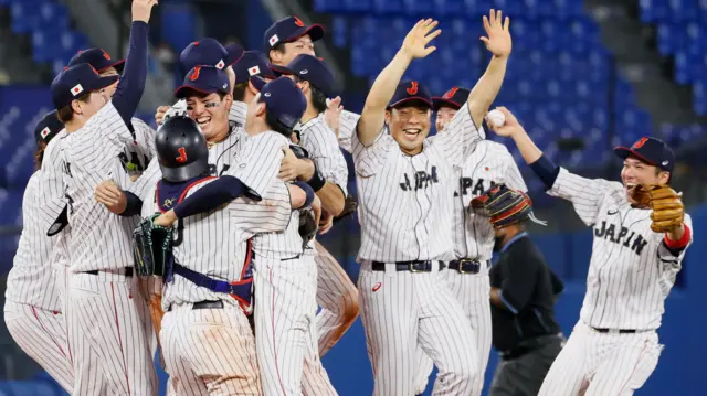 Japan baseball player celebrate after winning gold medal