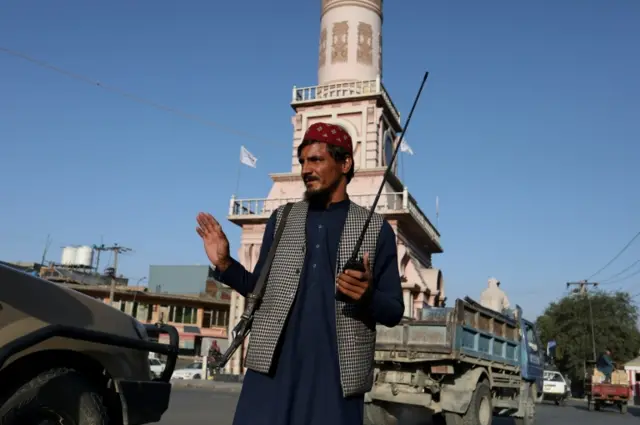 A Taliban soldier stands on a street in Kabul