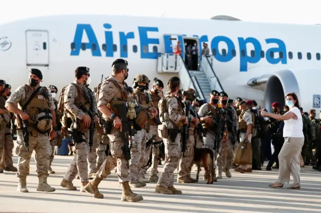 Spanish diplomatic, security staff and Afghan citizens evacuated from Kabul arrive at Torrejon Air Base, Spain. Photo: 27 August 2021