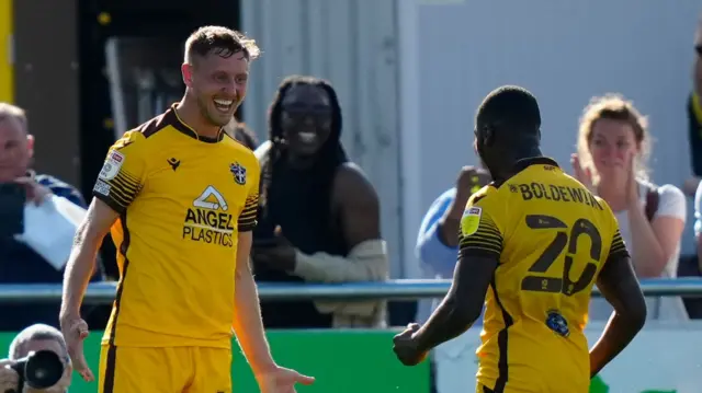 Richie Bennett celebrates scoring for Sutton United