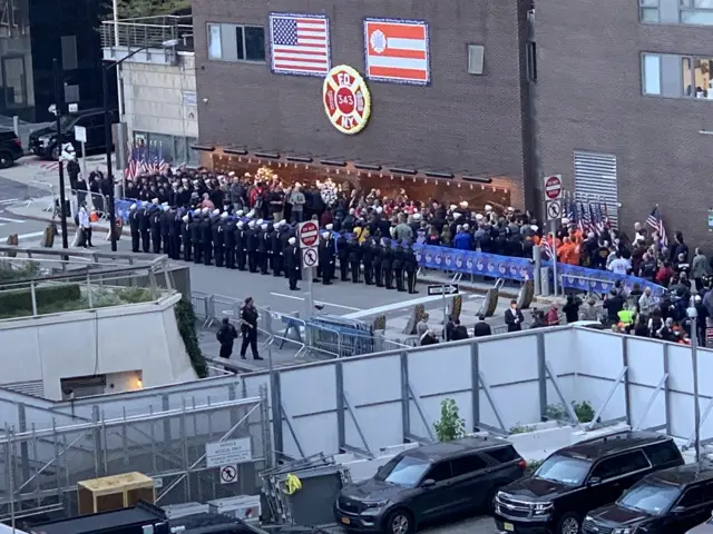 Firefighters paying respects to fallen colleagues at the memorial wall