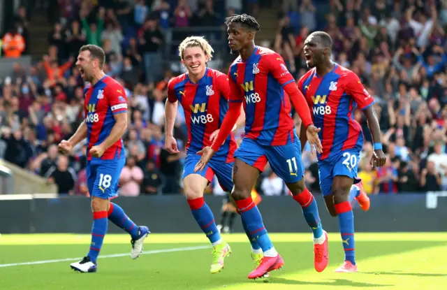 Wilfred Zaha celebrates scoring the opening goal