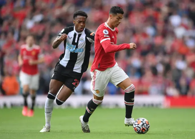 Ronaldo dribbles past Joe Willock