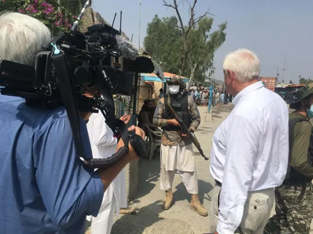 John Simpson speaks to Taliban guards