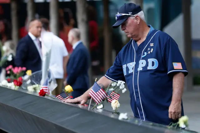 A man mourns at the site of the 9/11 memorial