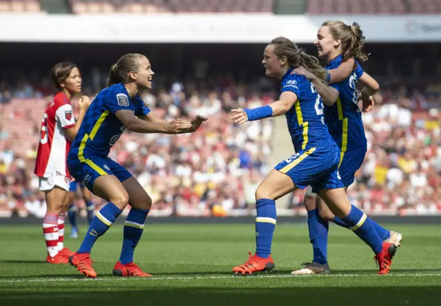 Chelsea players celebrate a goal against Arsenal on the opening weekend