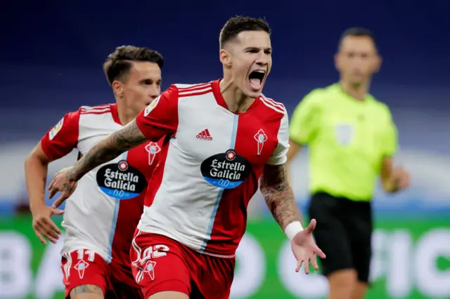 Santi Mina celebrates