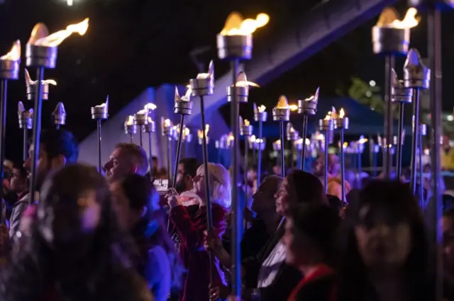 Members of the public take part in the Ceremony of Light procession at Millennium Place in Coventry