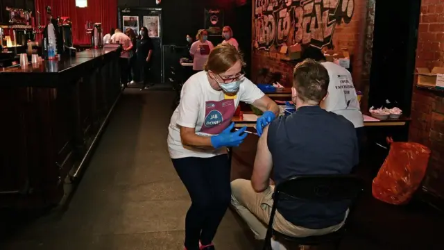 A man being vaccinated at Limelight in Belfast