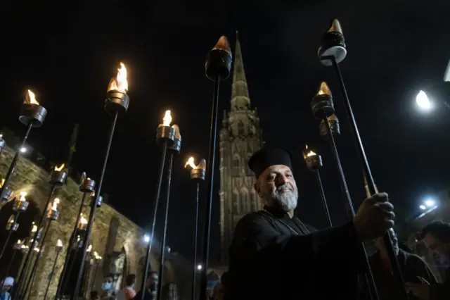 The Very Rev Theo Polyviou of the Greek Orthodox Church of the holy Transfiguration in Coventry takes part in the Ceremony of Light procession