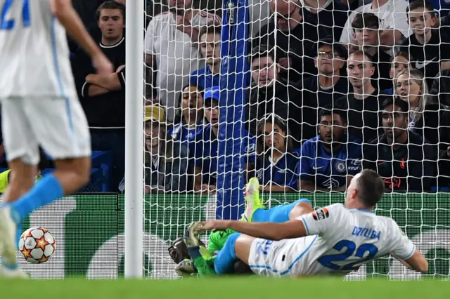 Artem Dzyuba misses the ball but clatters into Edouard Mendy