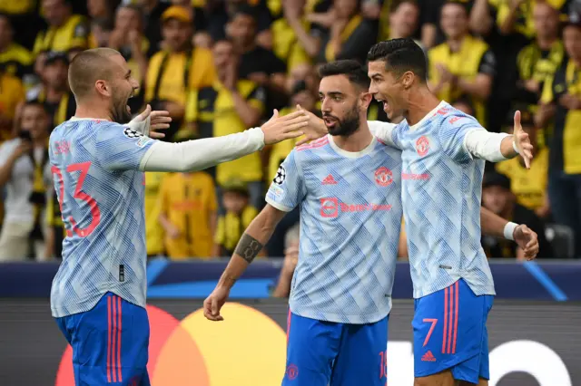 Luke Shaw, Bruno Fernandes and Cristiano Ronaldo celebrate Manchester United's opening goal