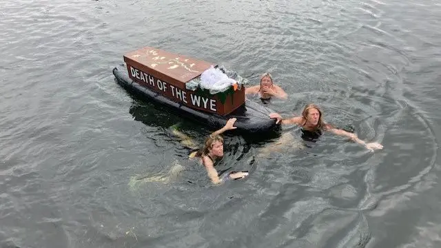 Swimmers with coffin