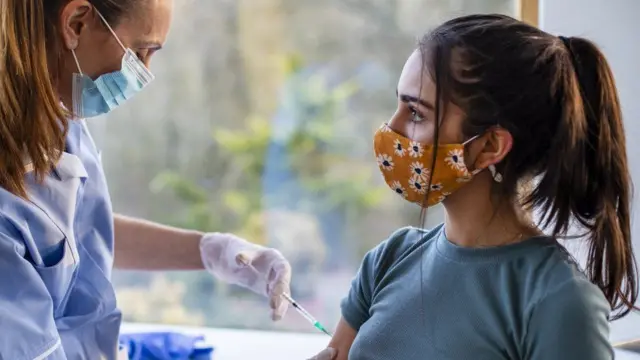 Young teenager getting vaccine