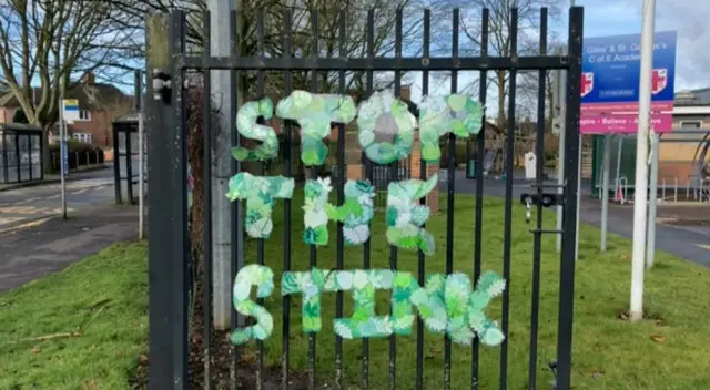 Protest sign on gate