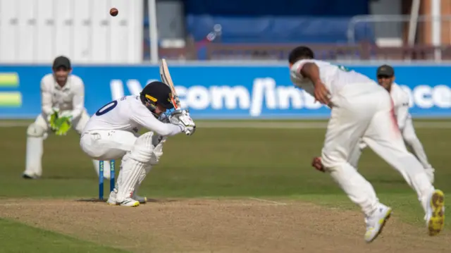 Sussex's Tom Haines ducks a bouncer