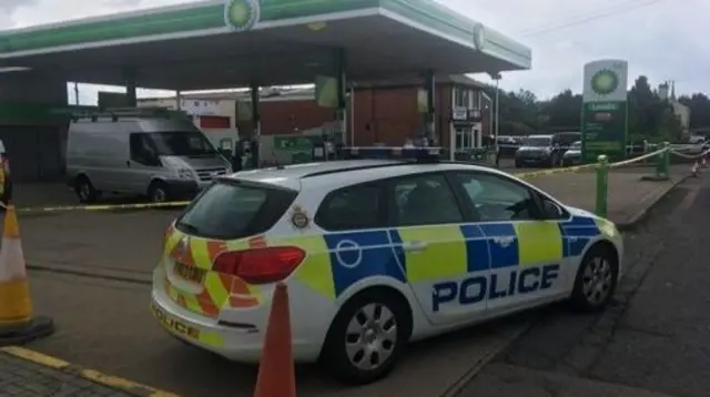 Police outside petrol station