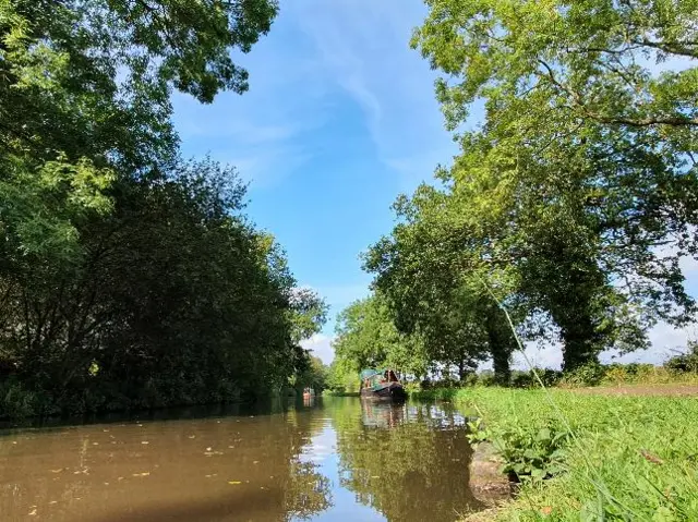 Blue skies over a canal in Lichfield