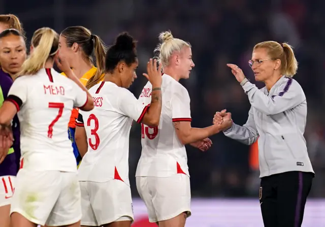 Sarina Wiegman celebrates her first England win with her players