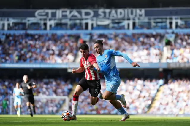 Jack Grealish of Manchester City is challenged by Valentino Livramento of Southampton