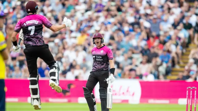 Craig Overton and Josh Davey celebrate Somerset's win.