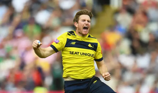 Liam Dawson celebrates a wicket.