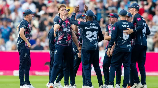 Kent celebrate a Sussex wicket.