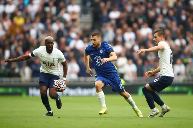 Mateo Kovacic of Chelsea is challenged by Tanguy Ndombele and Giovani Lo Celso of Tottenham