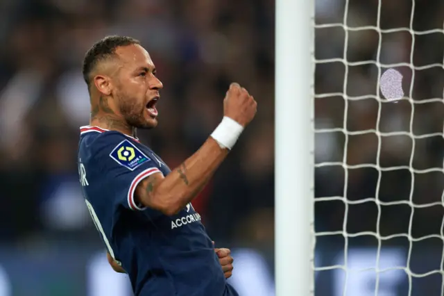 Neymar celebrates scoring a penalty for Paris St-Germain against Lyon.