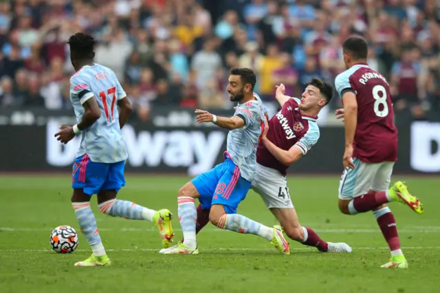 Bruno Fernandes of Manchester United under pressure from Declan Rice of West Ham