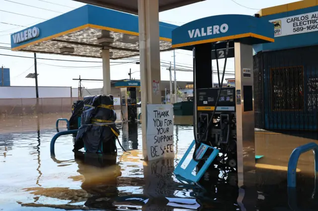 A flooded Valero gas station is seen in New Jersey