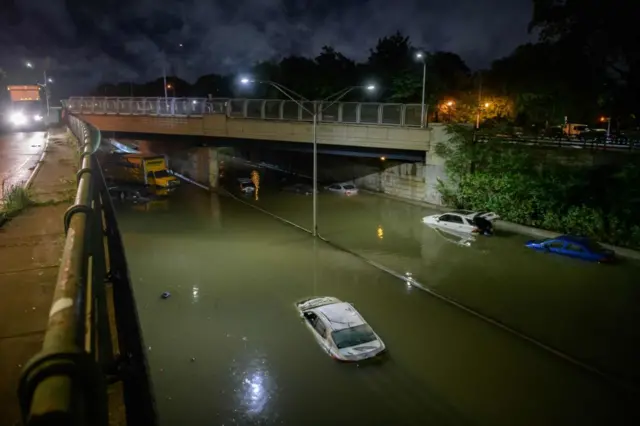 Stranded cars on a flooded road in Brooklyn, New York city