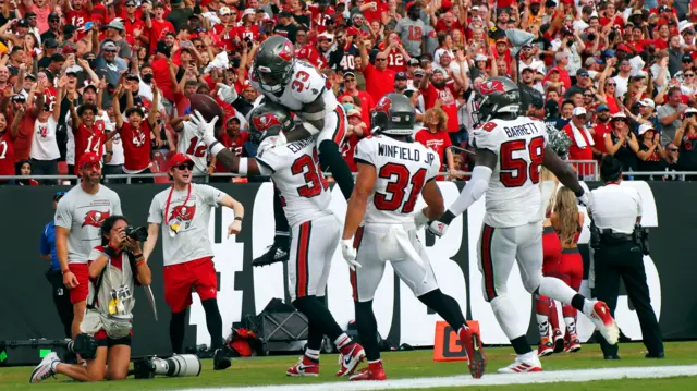 The Tampa Bay Buccaneers celebrate a Mike Edwards touchdown