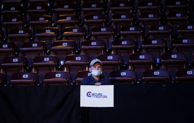 A Conservative party supporter holds a poster during the election night party, in Oshawa, Ontario, Canada, on 21 September 2021