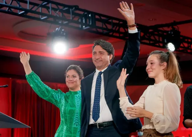 Canadian Prime Minister and Liberal Party leader Justin Trudeau (C), next to his wife Sophie Gregoire (L) and daughter Ella Grace (R), waves to supporters as he celebrates his election victory in Montreal, Quebec, Canada, on 20 September 2021