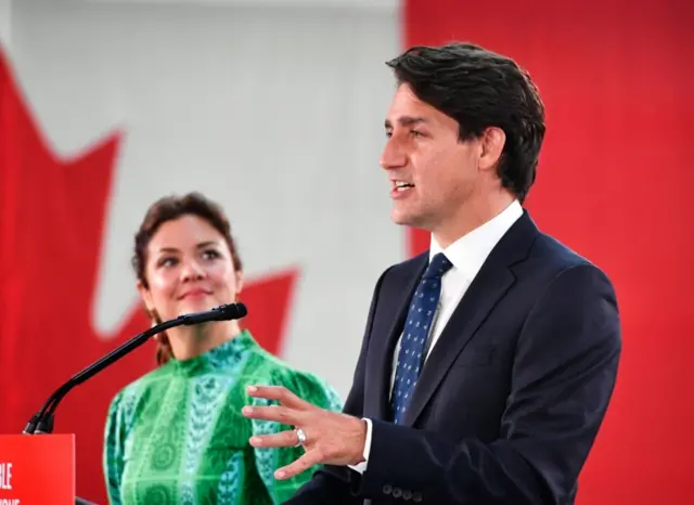 Canadian Prime Minister and Liberal Party leader Justin Trudeau (R), next to his wife Sophie Gregoire (L), addresses supporters as he celebrates his election victory in Montreal, Quebec, Canada, on 20 September 2021