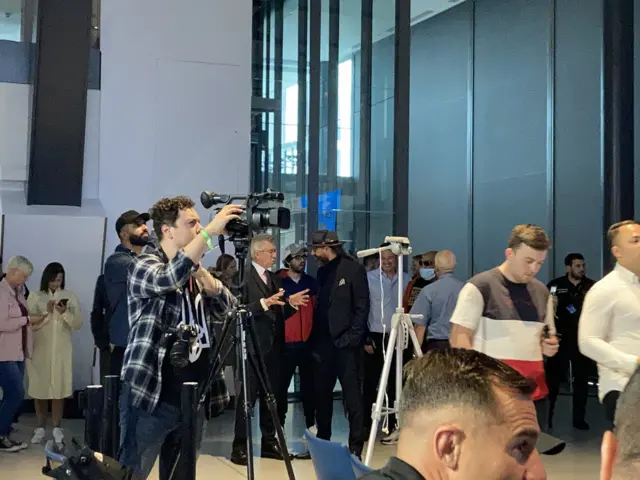 Michael buffer speaks to David Diamante at a press conference