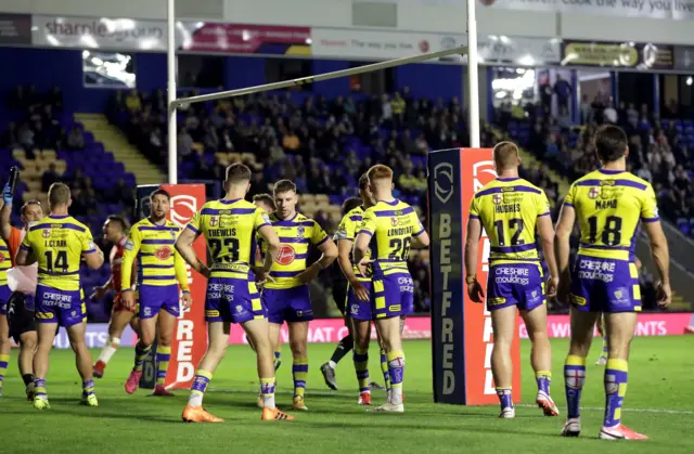 Dejected Warrington players