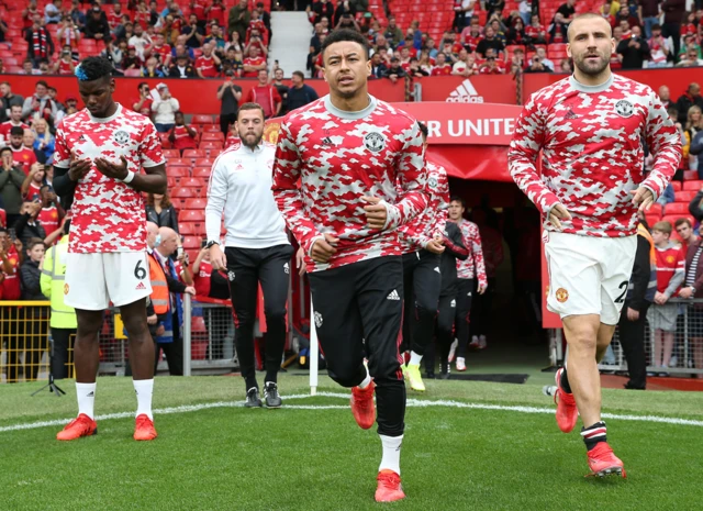 Manchester United players warming up at Old Trafford