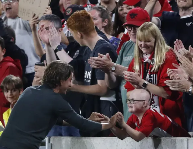 Brentford manager with fan