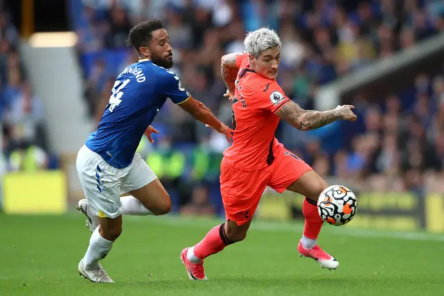 Andros Townsend of Everton with Mathias Normann of Norwich City