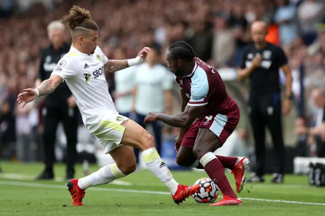 Michail Antonio of West Ham United battles for possession with Kalvin Phillips of Leeds United