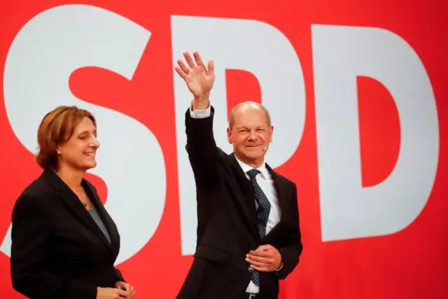 Olaf Scholz and his wife Britta Ernst react after first exit polls for the general elections in Berlin, Germany, September 26, 2021