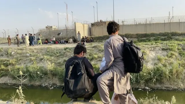 Afghan refugees in Kabul over the summer trying to leave