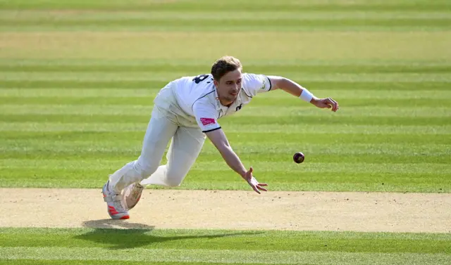 Craig Miles takes a caught and bowled chance offered by Alex Davies