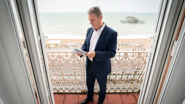 Sir Keir Starmer reading his speech