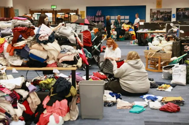 Volunteers sorting through donations to support Afghan refugees