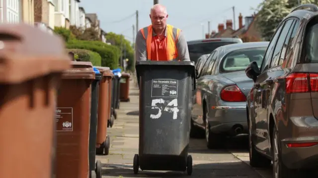 A bin being moved