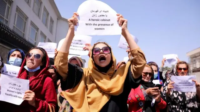 Afghan women's rights defenders and civil activists protest to call on the Taliban for the preservation of their achievements and education, in front of the presidential palace in Kabul, Afghanistan