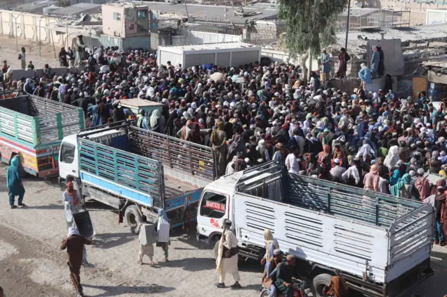 People wait to cross into Pakistan at the Spin Boldak border crossing.